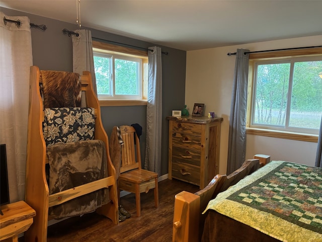 bedroom with dark wood-type flooring