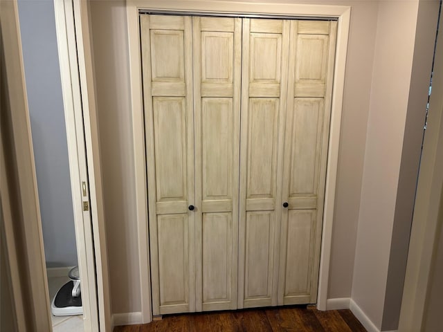 details featuring wood finished floors and baseboards