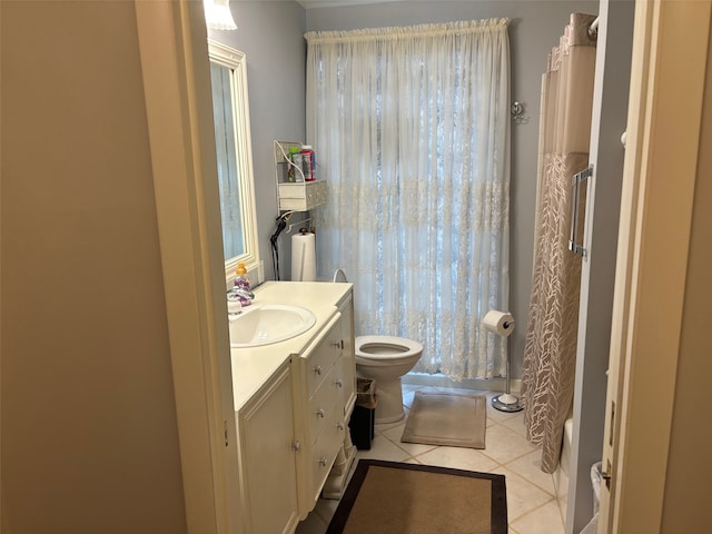 full bathroom featuring tile patterned flooring, toilet, shower / tub combo with curtain, and vanity