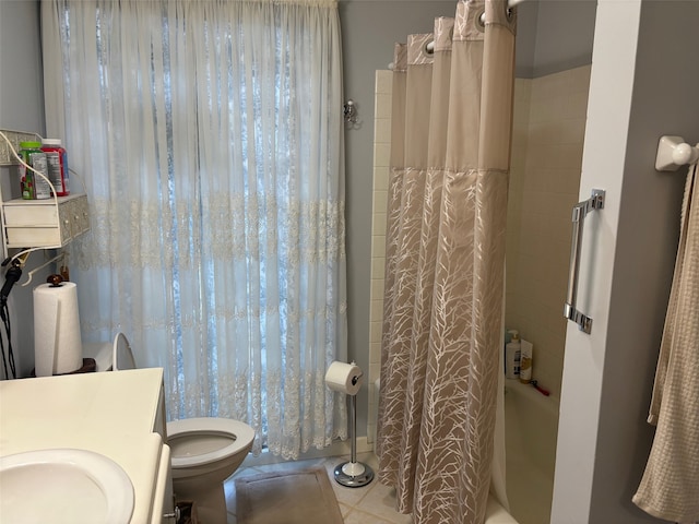 full bathroom with vanity, toilet, tile patterned floors, and shower / bath combo with shower curtain