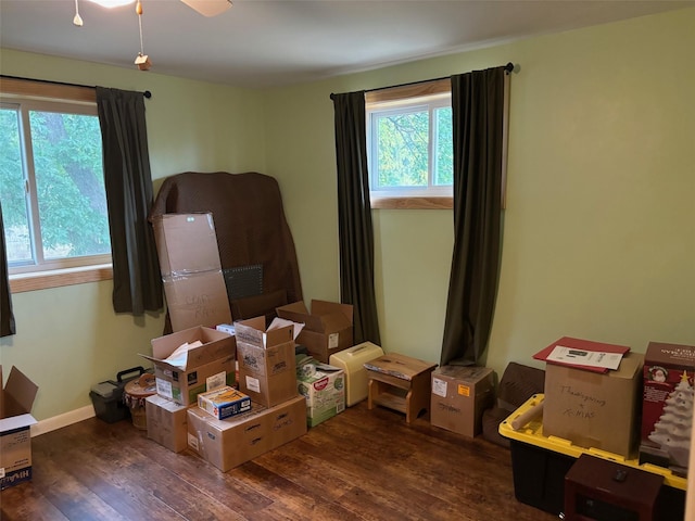 interior space featuring wood finished floors and baseboards