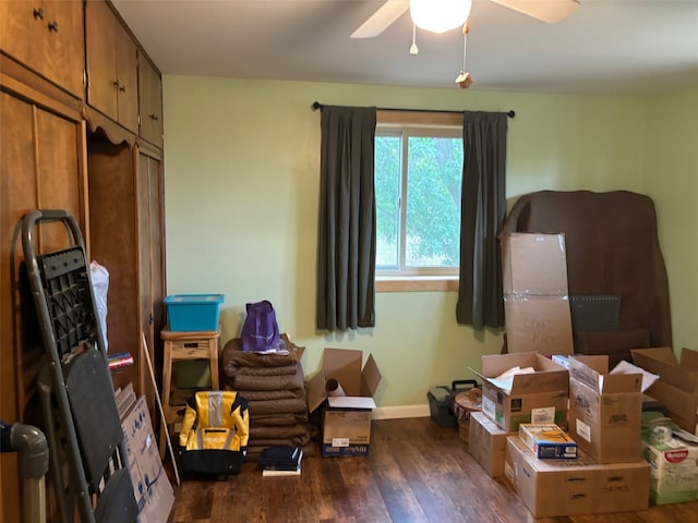 misc room featuring ceiling fan and dark hardwood / wood-style floors