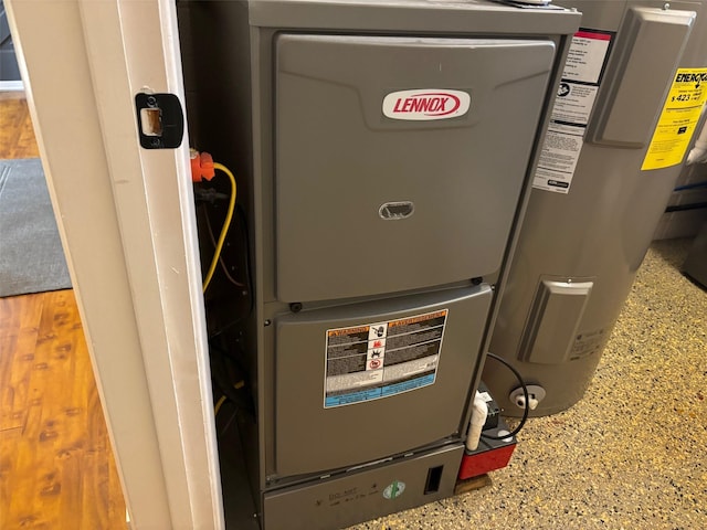 utility room with electric water heater