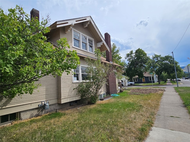 view of home's exterior featuring a lawn