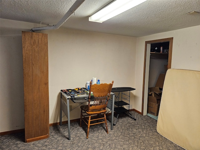 dining room featuring a textured ceiling