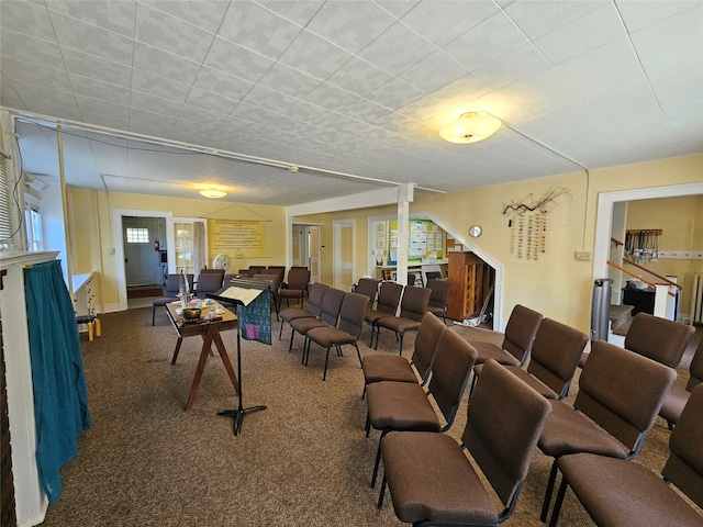 carpeted living room with a healthy amount of sunlight