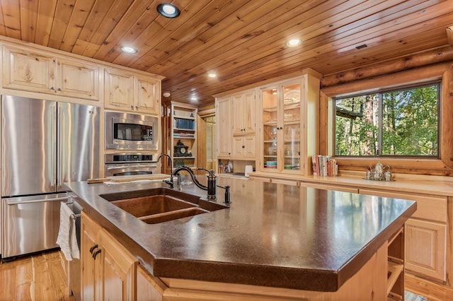 kitchen with a kitchen island with sink, wood ceiling, light hardwood / wood-style flooring, and appliances with stainless steel finishes