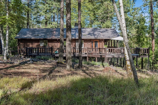 rear view of property with a deck