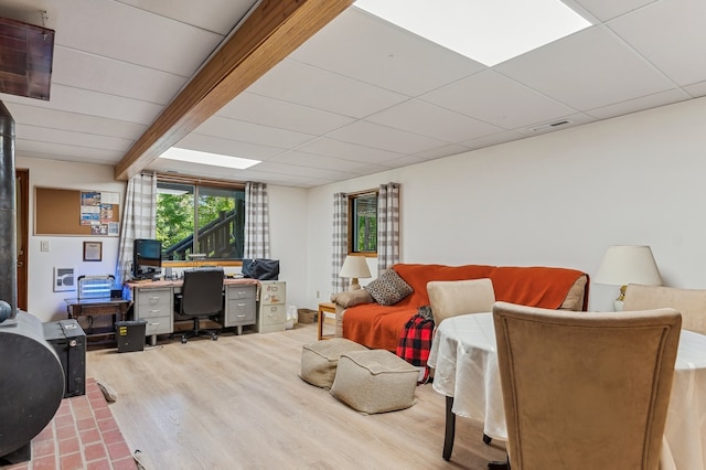 living room with hardwood / wood-style flooring and beamed ceiling