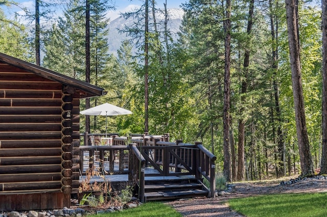 exterior space featuring a deck with mountain view