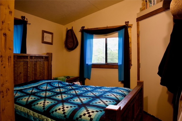 bedroom featuring lofted ceiling