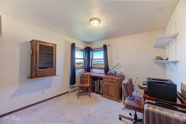 carpeted office space featuring a baseboard heating unit and a textured ceiling