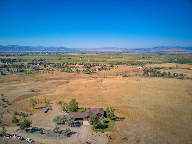 drone / aerial view featuring a rural view and a mountain view