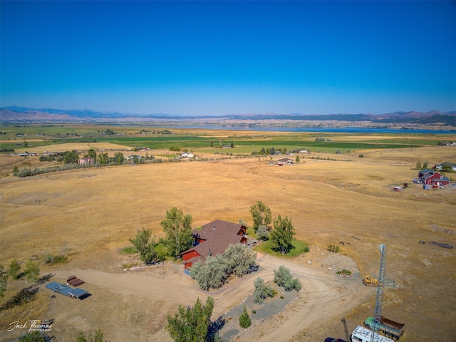 birds eye view of property with a mountain view and a rural view