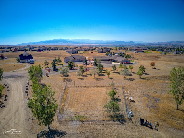 drone / aerial view featuring a rural view and a mountain view