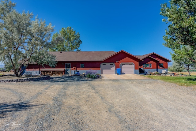 ranch-style house featuring a garage