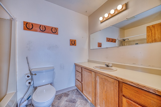 bathroom with toilet and vanity