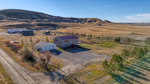 drone / aerial view with a rural view and a mountain view