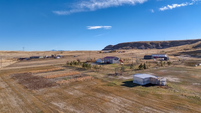 aerial view featuring a mountain view and a rural view