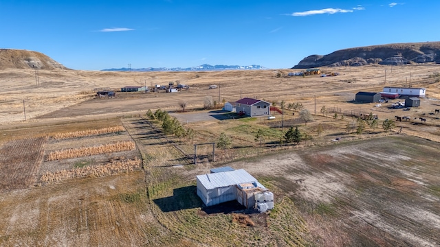 birds eye view of property featuring a rural view and a mountain view