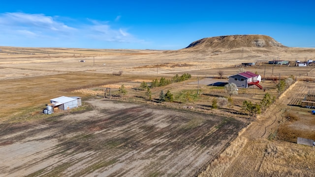 bird's eye view with a mountain view and a rural view