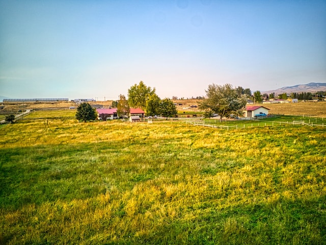 view of yard featuring a mountain view and a rural view