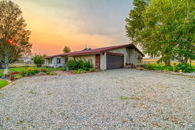 single story home with a garage