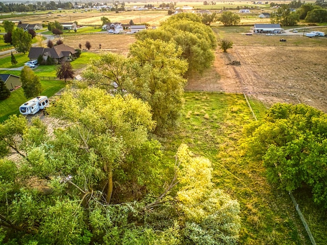 birds eye view of property with a rural view