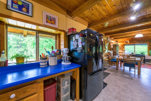 510 Johnson Ln, Superior, MT 59872 - kitchen with freestanding refrigerator, wood ceiling, and beam ceiling