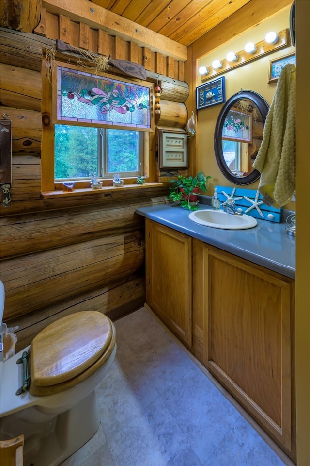 510 Johnson Ln, Superior, MT 59872 - bathroom featuring log walls, wood ceiling, and vanity