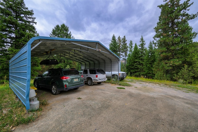 510 Johnson Ln, Superior, MT 59872 - view of car parking with asphalt driveway and a carport