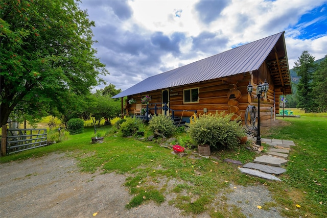 510 Johnson Ln, Superior, MT 59872 - view of side of home with log exterior and metal roof