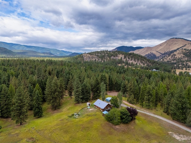 510 Johnson Ln, Superior, MT 59872 - drone / aerial view of a heavily wooded area and a mountain backdrop