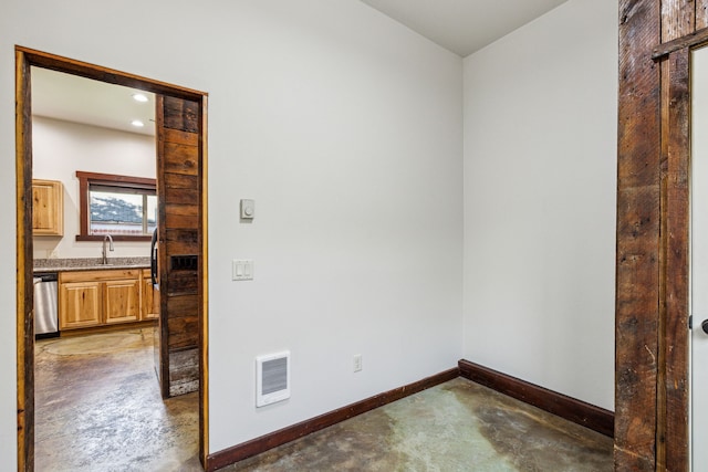 spare room with concrete flooring