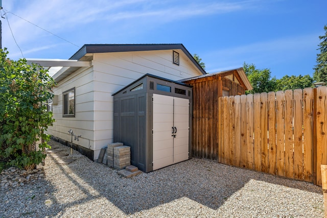 exterior space with a storage shed