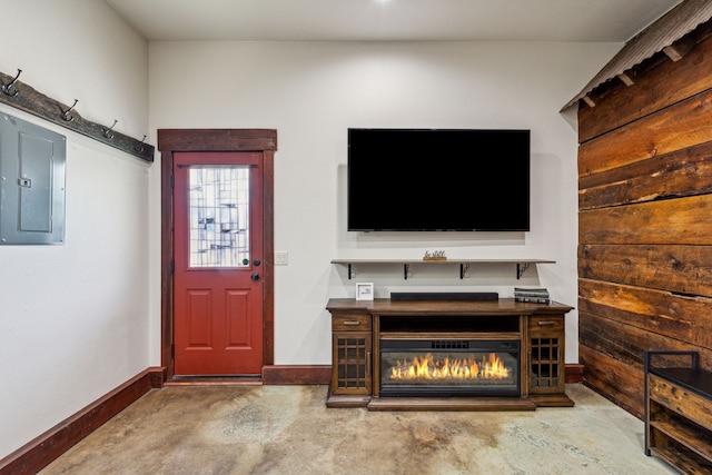 entrance foyer featuring concrete flooring and electric panel