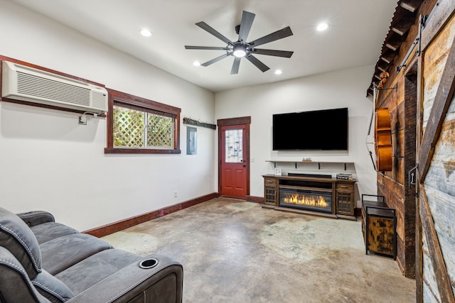 living room with a wall mounted air conditioner, concrete flooring, and ceiling fan