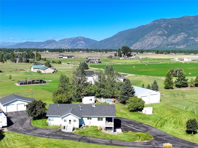 birds eye view of property featuring a mountain view and a rural view