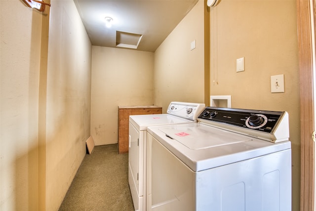 washroom featuring light colored carpet and washer and clothes dryer