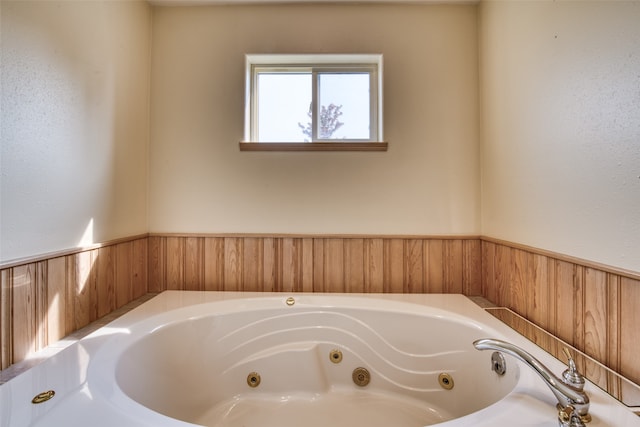 bathroom featuring a tub to relax in