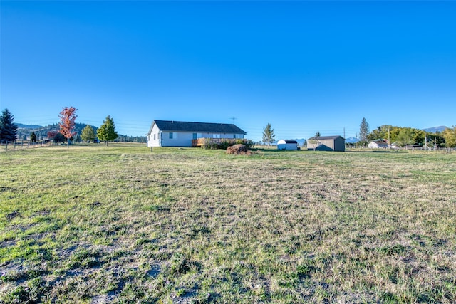 view of yard with a rural view