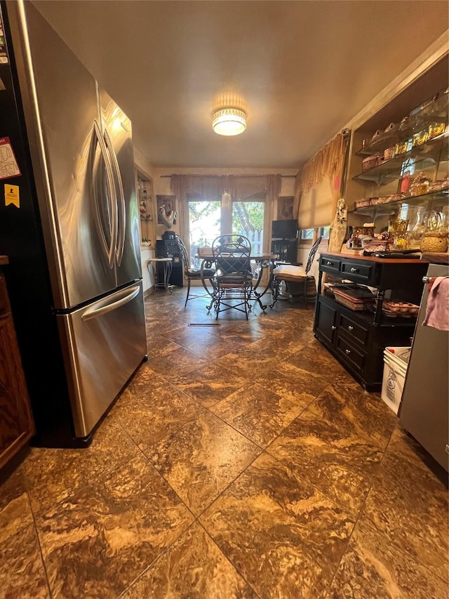 kitchen featuring freestanding refrigerator