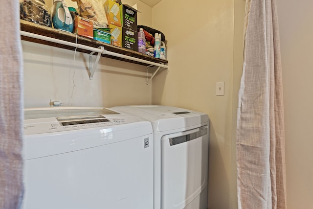 clothes washing area featuring washing machine and dryer