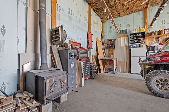 interior space featuring white fridge and a workshop area