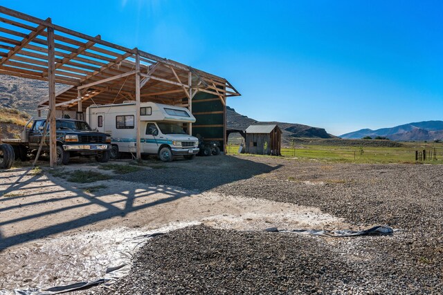 view of car parking with a mountain view