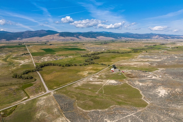 drone / aerial view featuring a rural view and a mountain view