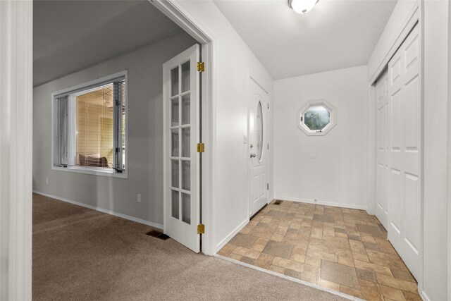 foyer with carpet