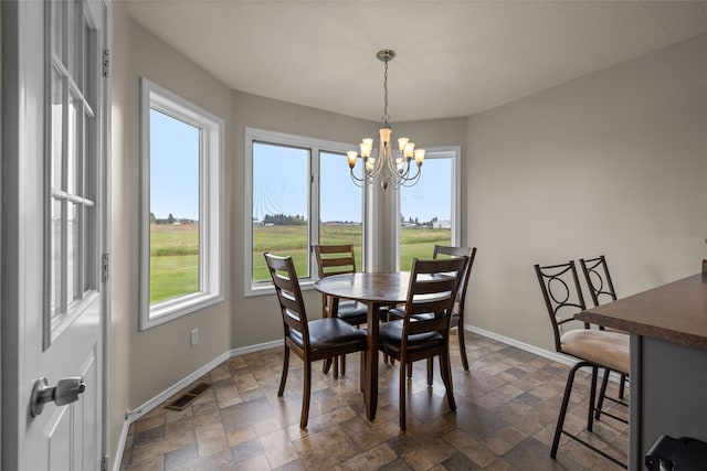 dining space featuring a chandelier