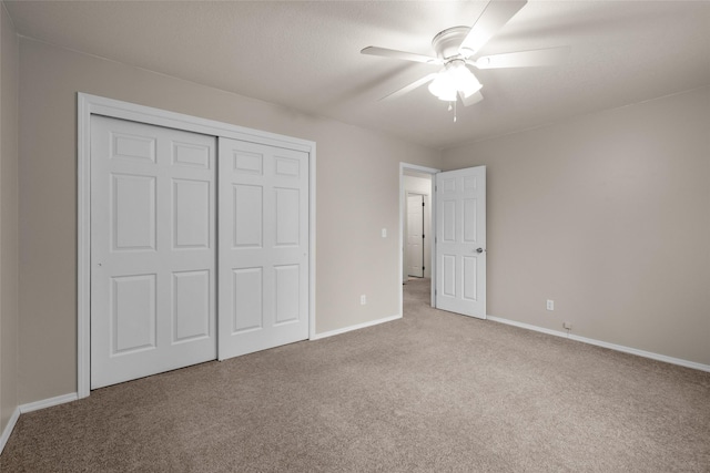 125 Ponderosa Ln, Kalispell, MT 59901 - unfurnished bedroom featuring carpet floors, a closet, and a ceiling fan