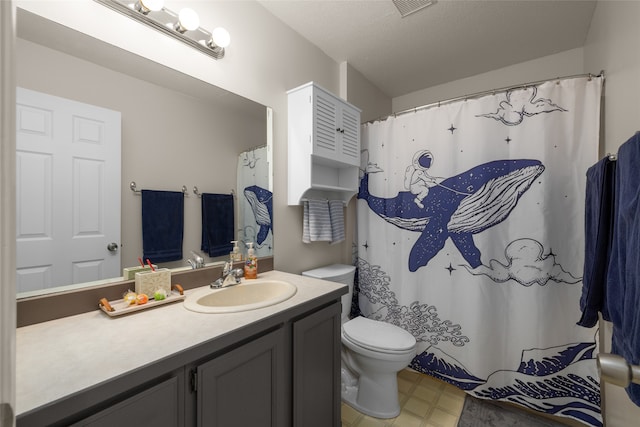 bathroom with walk in shower, vanity, and toilet